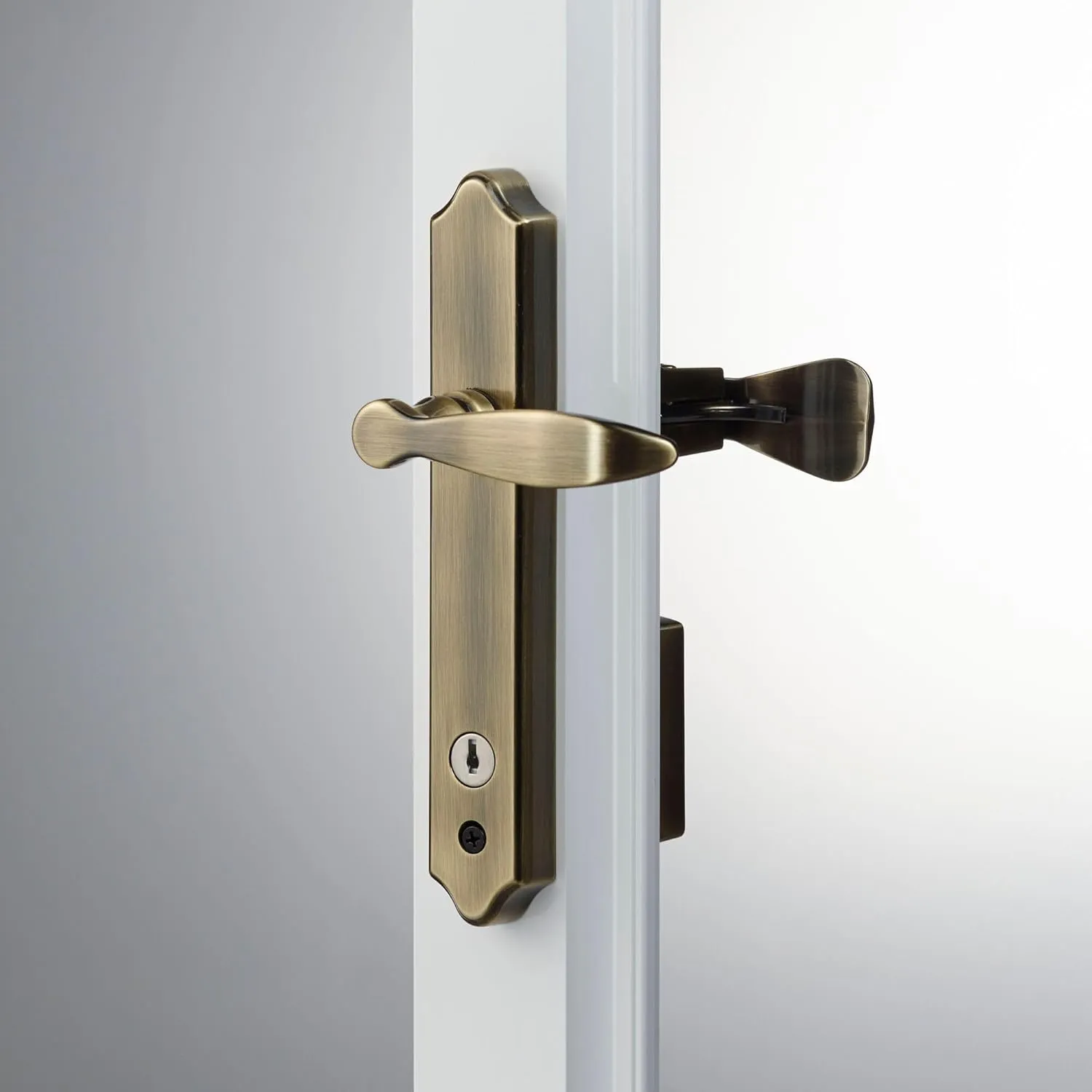 Ideal Security 1216 Surface Mount Storm Door Handle with Lock and Key for 1 – 1 ½ inches Thick Doors (Antique Brass, 4-Posts)