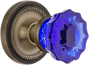 Nostalgic Warehouse 721037 Rope Rosette Crystal Cobalt Glass Door Knob in Antique Brass, Passage 2.375